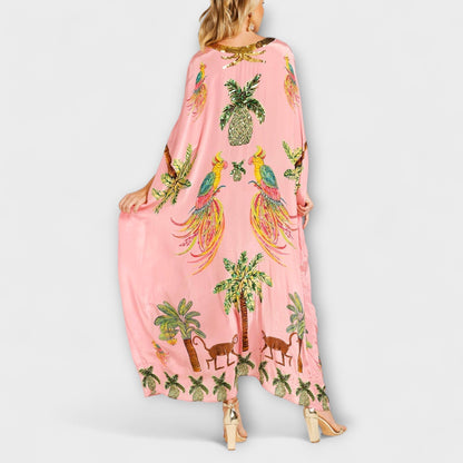 Linda - Impresionante vestido con tirantes asimétricos y estampado de palmeras