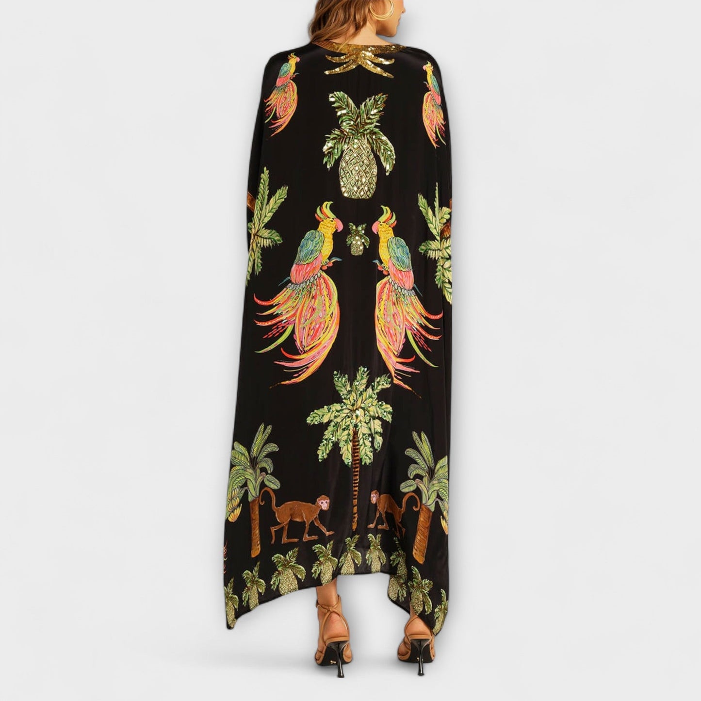 Linda - Impresionante vestido con tirantes asimétricos y estampado de palmeras
